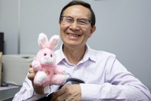 Quyen Di Chuc Bui posing with a stuffed animal