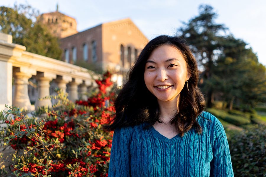 Leia Yen smiles in a portrait with Royce Hall in the background