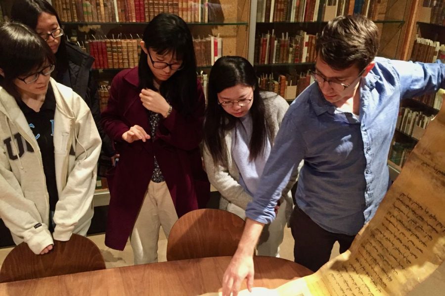 Devin Fitzgerald works with students in UCLA Library's Special Collections