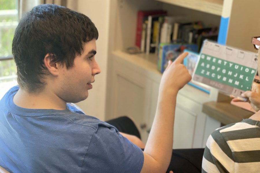 Woody Brown demonstrates how he communicates via letter board