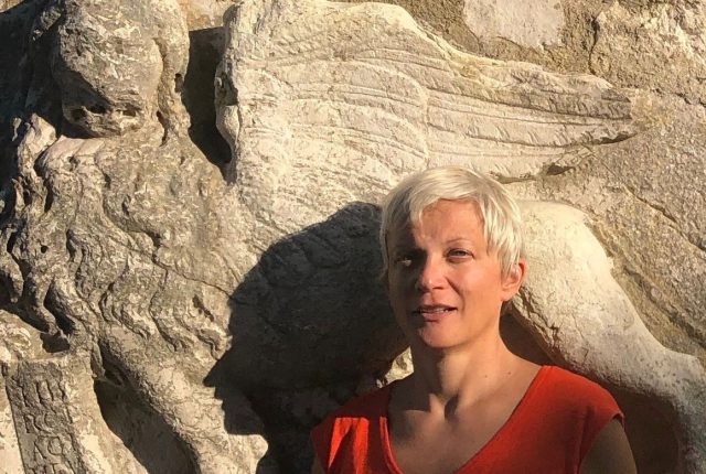 Zrinka Stahuljak in front of a 15th-century relief of the winged lion of Venice. Each quarter, she guides students through explorations of paintings, sculptures and architecture, encouraging them to find deeper meaning about the people who created them.
