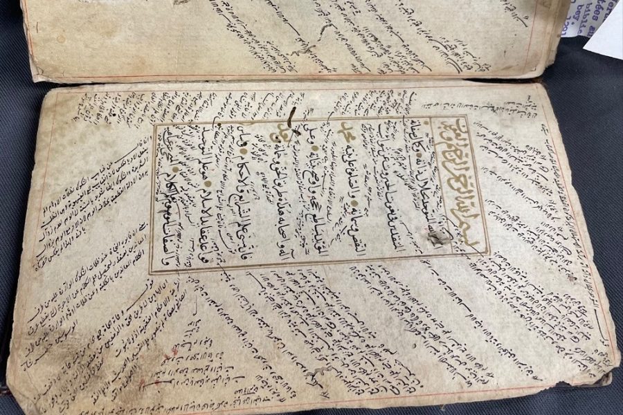 Image of Manuscript of religious commentary. In this image, al-Taftāzānī’s sharḥ (commentary) on al-Nasafī’s al-ʿAqāʾid al-Nasafīyya (the creed of an-Nasafī) can be seen within the textblock. In the marginalia and between the text, glosses on this commentary and intertextual references by several different scholars can be found.