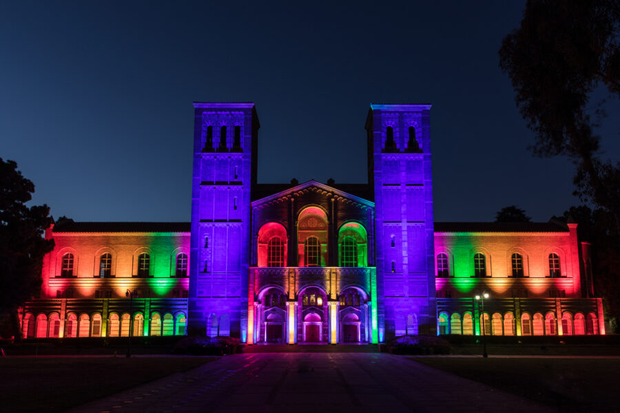 UCLA Royce Hall at night, lit with rainbow colors