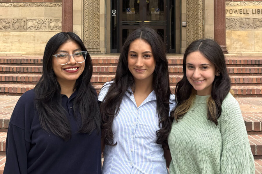 Kathryn Quick, Shahzareh Ali and Inesa Wenn in front of UCLA Powell Library