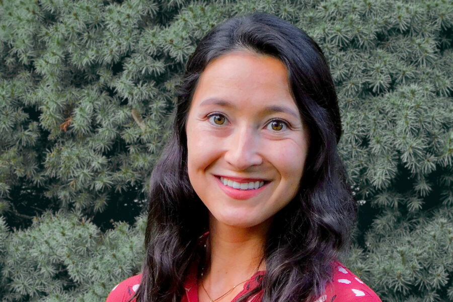 Jennifer Noji with evergreen trees in background