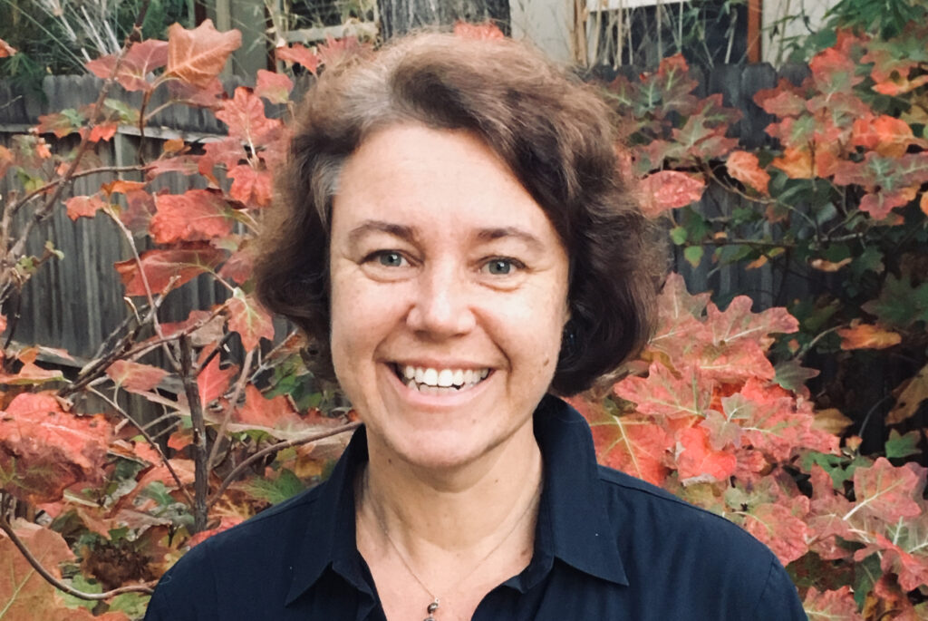 Portrait Barbara Fuchs with foliage in background