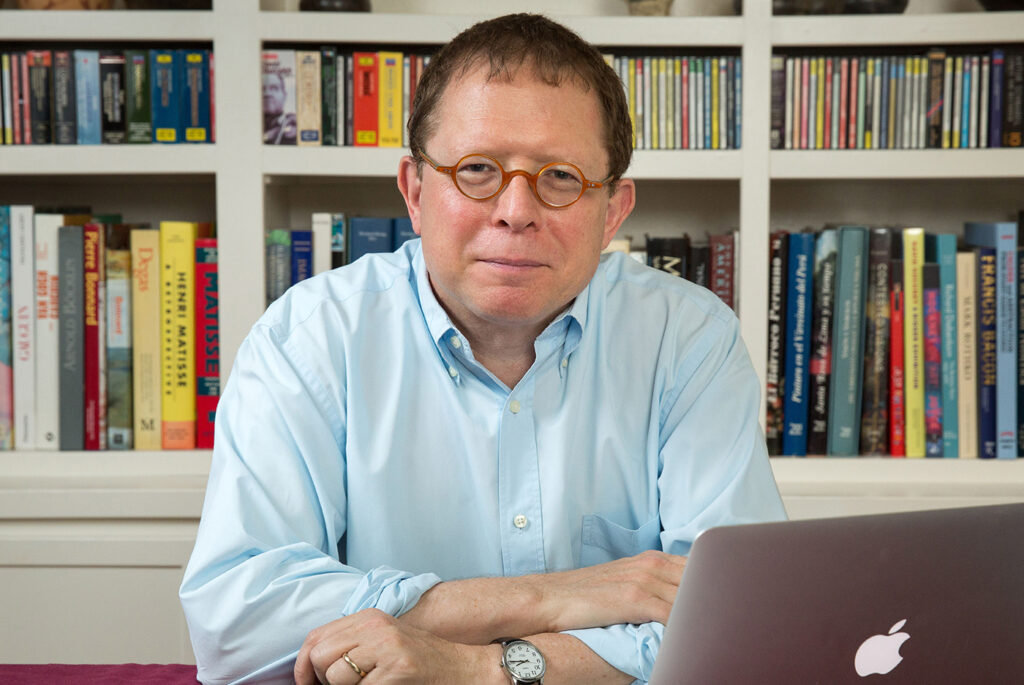 Portrait of Efrain Kristal at his desk in 2015