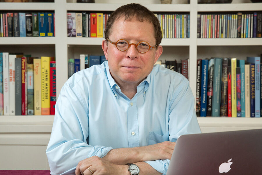 Portrait of Efrain Kristal at his desk in 2015