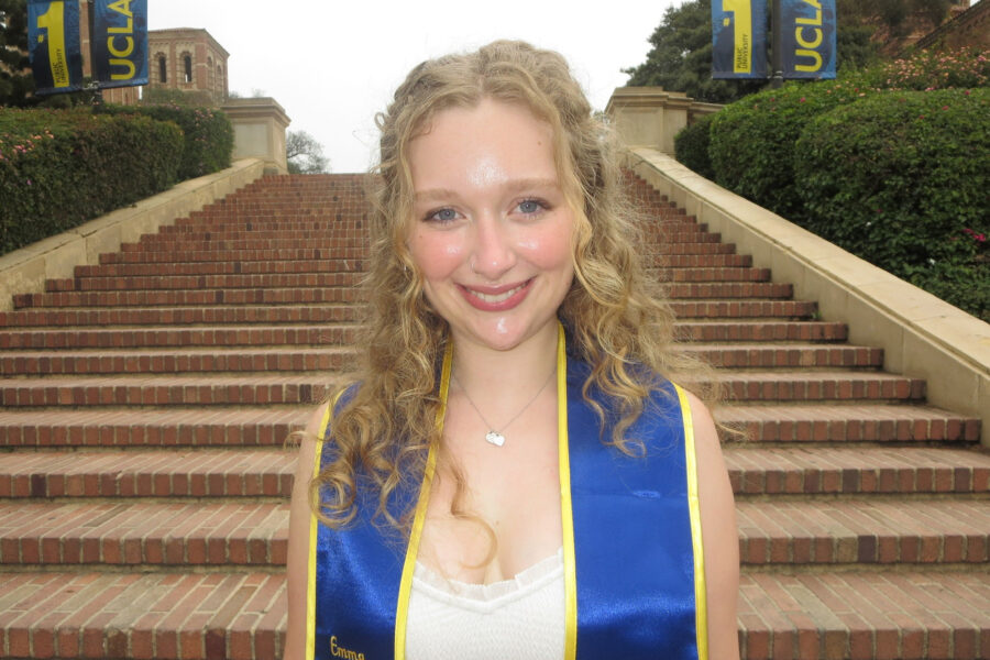 Emma Montilla wearing graduation sash on Janss Steps